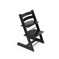 Black wooden high chair with adjustable seat and footrest. 
