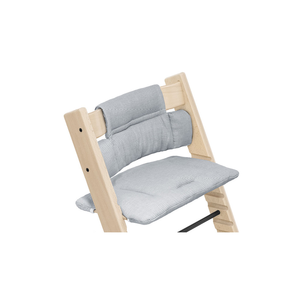 Wooden high chair featuring a soft, gray gingham seat cushion and backrest for comfortable mealtimes. 
