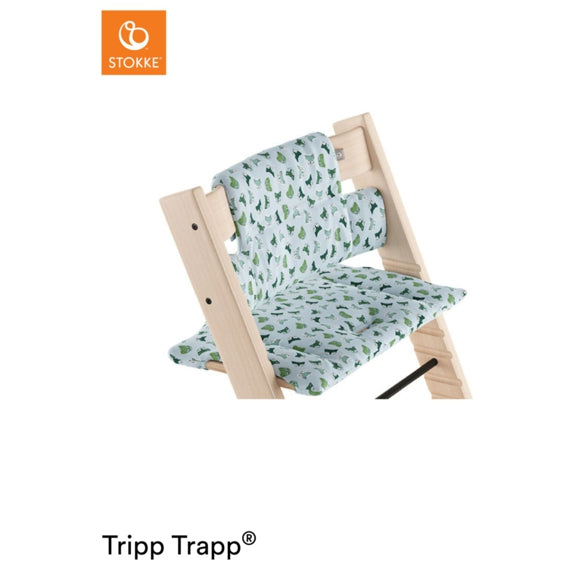 Stokke Tripp Trapp high chair fitted with a light blue, leaf-patterned seat cushion. 
